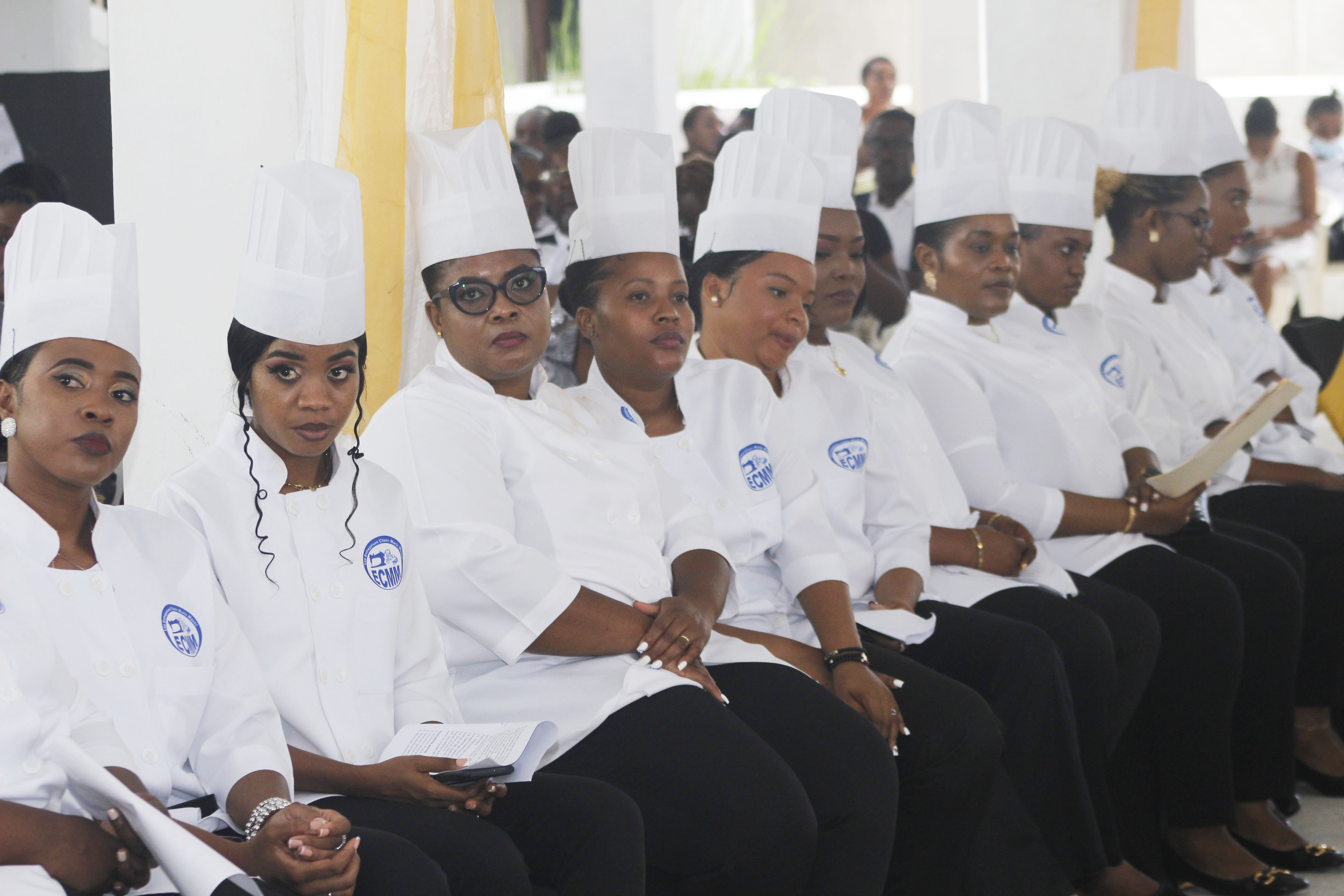 Graduates in caps and gowns at the graduation ceremony